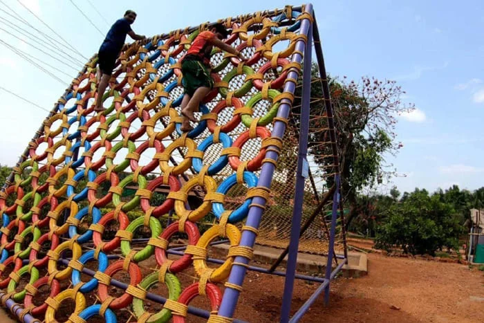 Climb your way to the top with the Tyre Wall at Veda Adventures